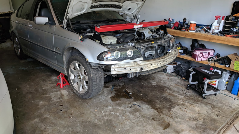 Nervously supporting the engine with Harbor Freight engine support bar. It worked great!